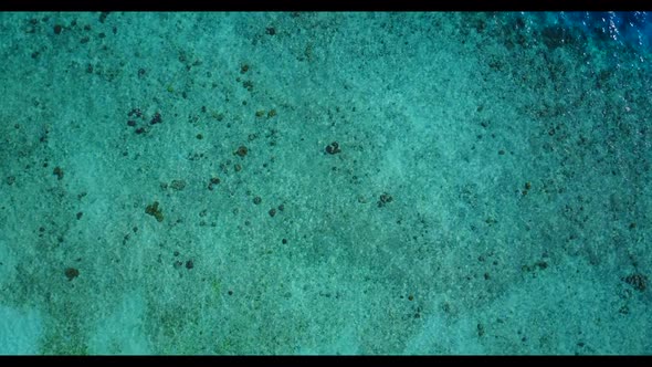 Aerial top view abstract of tranquil island beach holiday by transparent sea and bright sandy backgr