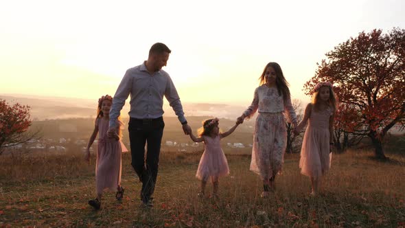 Family walking on a hill