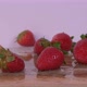 Strawberries Being Dropped While Rotating Over White Background - VideoHive Item for Sale
