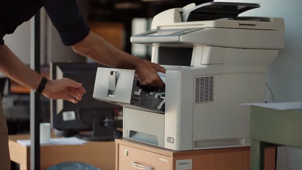 Businessman Working In Office And Preparing Documents For Signature. Man Using Printer Or Scanner.
