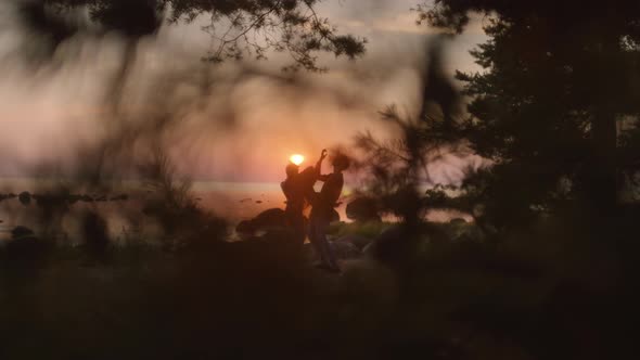 Cinematic Couple Slowly Dance at Sunset Beach