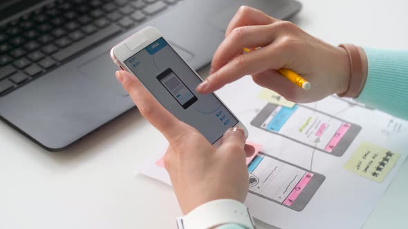 Designer Working on Smartphone Interface Design 11