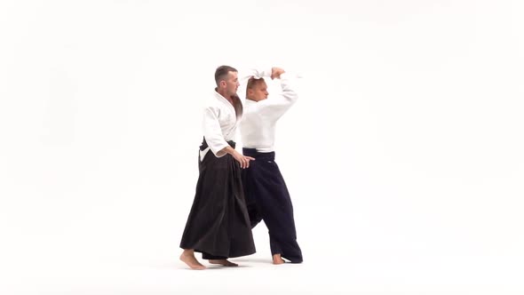 Two Guys Showing Aikido Using Tanto. Isolated, White. Close Up. Slow Motion.