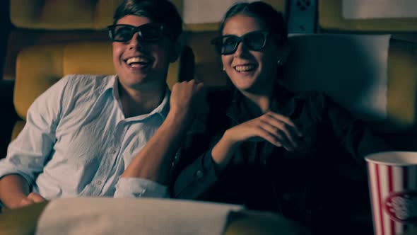 Man and Woman in the Cinema Watching a 3D Movie