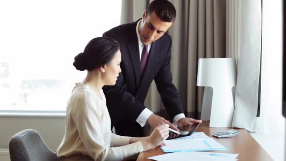 Business Team with Papers and Tablet Pc at Hotel 