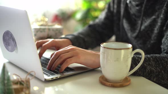 Close Up of Man Hands with Gifts Coffee Cup and Laptop