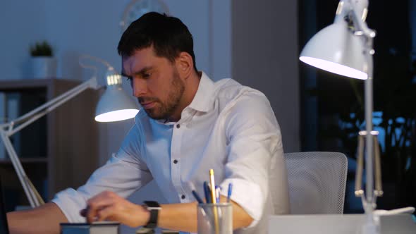 Businessman with Laptop Working at Night Office 36