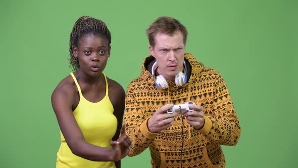 Young Multi-ethnic Couple Playing Games Together