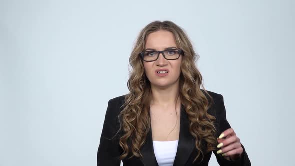 Studio Portrait of Annoyed Woman Gesturing in Stress Expressing Irritation and Anger, Slow Motion