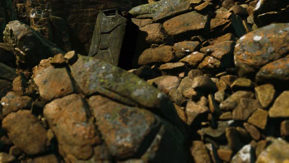 Old Rusty Metal Canister for Gasoline Fuel at Rocks