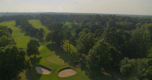 Flying Over Bunker and a Golf Course with Trees in Glen Head Long Island