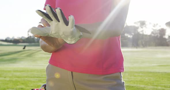 Female golfer wearing golf glove