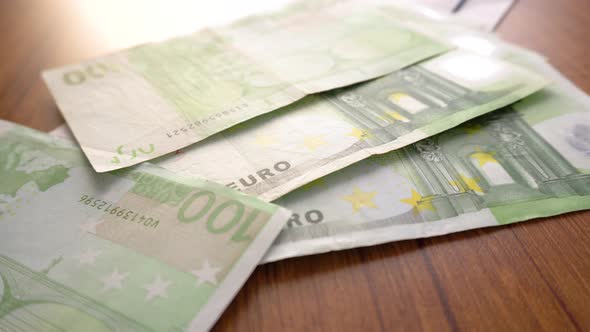 Euro Money Banknotes. Hands counting Euros bills as part of the united country's payment system.