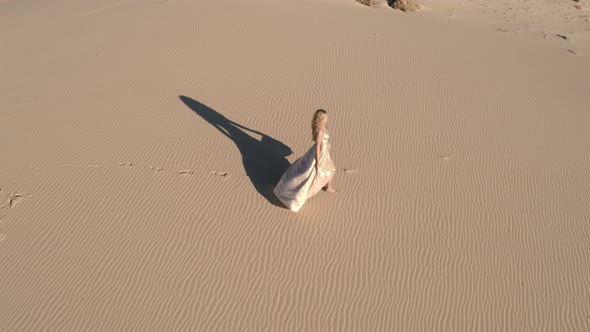 Walking Girl On Sandy Beach In Ballgown