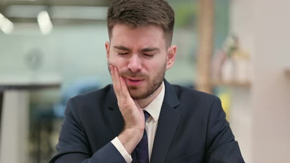 Allergic Young Businessman Having Toothache