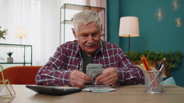 Happy Grandfather Man Counting Calculating Cash Money Dollars Planning Expenses Financial Budget