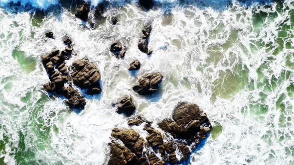 Waves of the Atlantic Ocean crash on coastal rocks