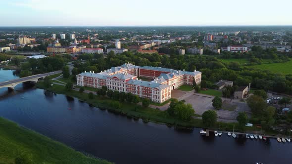 Aerial View of Jelgava City Panorama and Lielupe River in Latvia, Zemgale at Sunset 4K Dron Shot alt