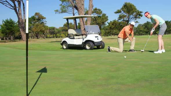 Golfers playing golf