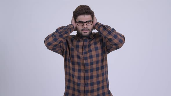 Stressed Young Bearded Indian Hipster Man Not Wanting To Hear Something