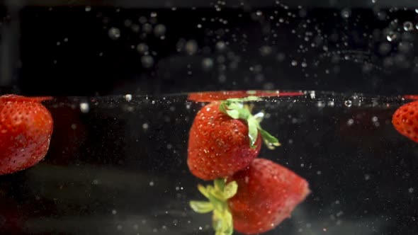 Strawberry Hitting Another One when Falling in The Water