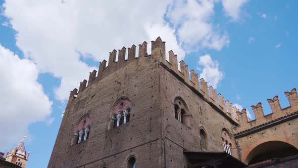 Ancient Palazzo Re Enzo Top Against Blue Sky in Bologna