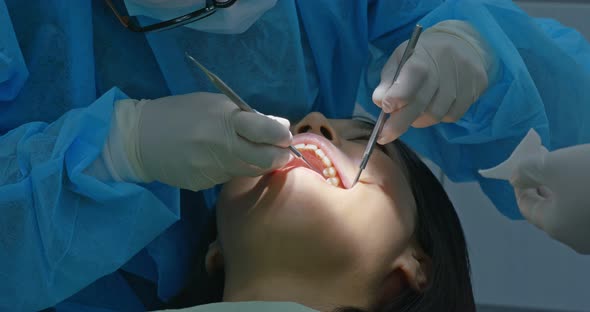 Woman undergo dental check up in clinic