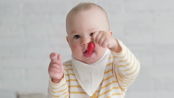 Portrait Eating Baby at Home