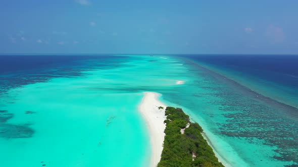 Natural above copy space shot of a sunshine white sandy paradise beach and aqua blue water backgroun