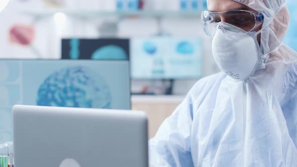 Close Up Shot of Researcher Face Wearing a Protective Mask and Glasses