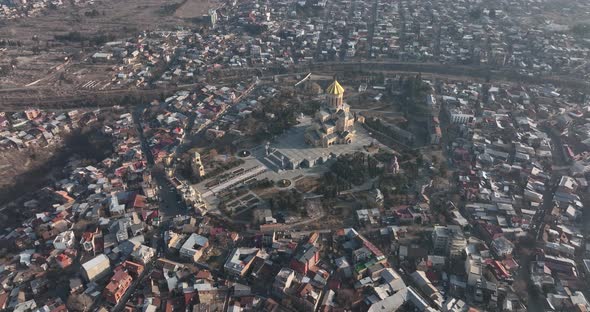 Aerial view of Holy Trinity Cathedral Sameba in Tbilisi Georgia. Sunrise drone footage.