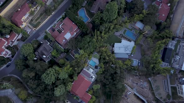 Aerial top down view of luxurious houses in a wealthy neighborhood of Los Angeles.