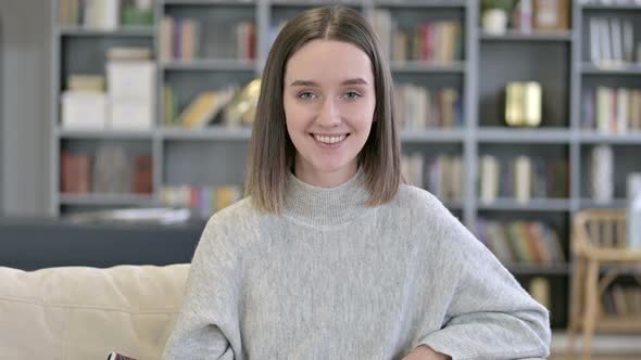 Portrait of Young Woman Saying Yes By Shaking Head