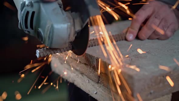 Cutting an iron bar with a sander