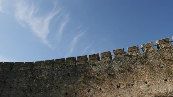 A stone wall and a blue sky