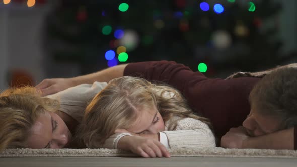 Family Fallen Asleep Under Christmas Tree Waiting Santa Claus, Belief in Magic