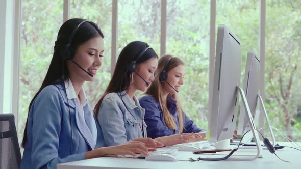 Customer Support Agent or Call Center with Headset Talking to Customer on Phone