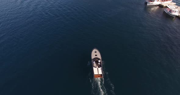 Motor Boat Sails on the Sea Past the Island