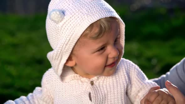 Cute Portrait of Little Baby Boy Playing with Mother in Park or Green Garden. Smiling Happy Lovely