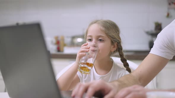 Closeup Portrait of Charming Beautiful Caucasian Girl Drinking Juice in the Morning Looking at