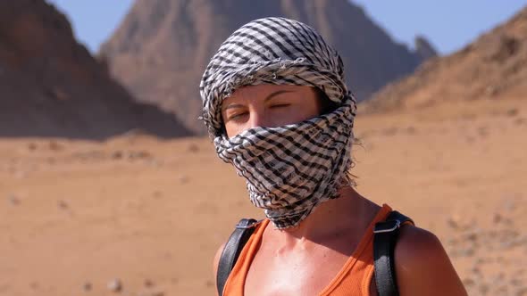 Girl in the Keffiyeh in Desert of Egypt