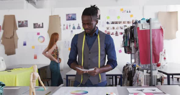 Mixed race man working in creative office