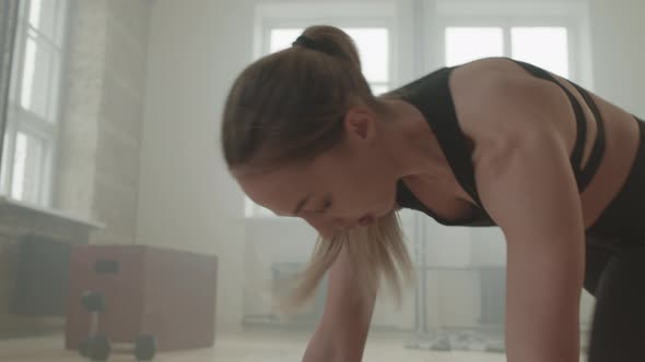 Fit Woman Doing Running Plank Exercise