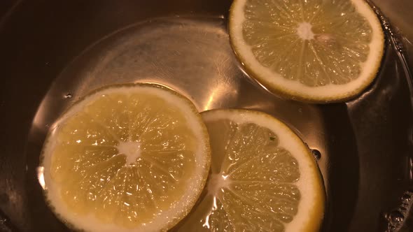 Lemon cooking for cake topping close-up 4K 2160p 30fps UltraHD footage - Citrus cooked in the boilin