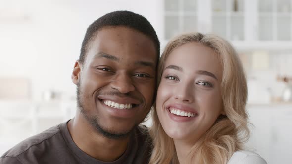 Happy Multiracial Couple Smiling To Camera Posing Indoors