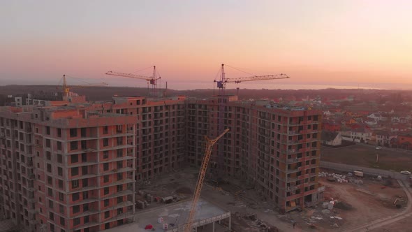 Construction Site in the Middle of the City and Private Houses at Sunset in .