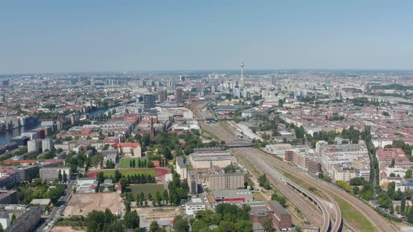 Aerial View of Main Railway Track Leading Through Large City