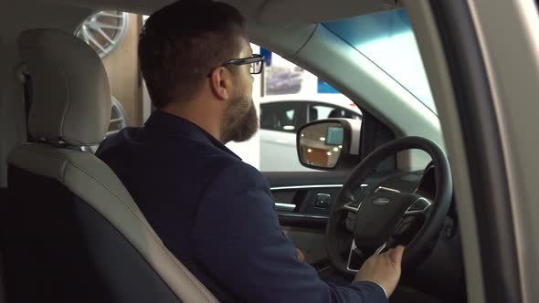 Male Customer Shows Key Inside the Car