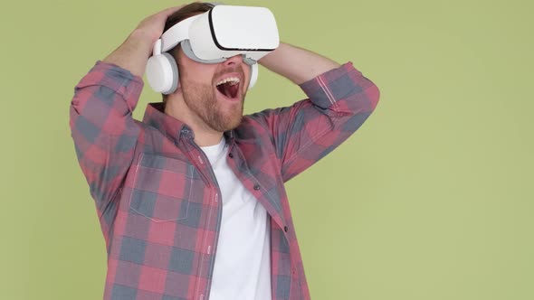 A Surprised Man in a VR Headset Shakes His Head