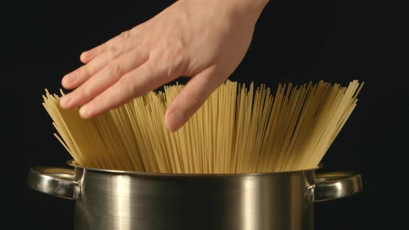 A Cook Touches A Bunch Of A Spaghetti In A Steel Pot